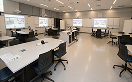 image showing a WALS classroom with moveable tables and chairs and screens