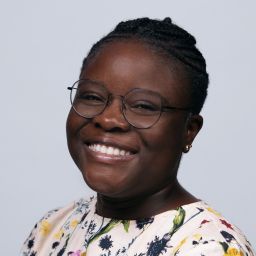Professional headshot of an African lady smiling